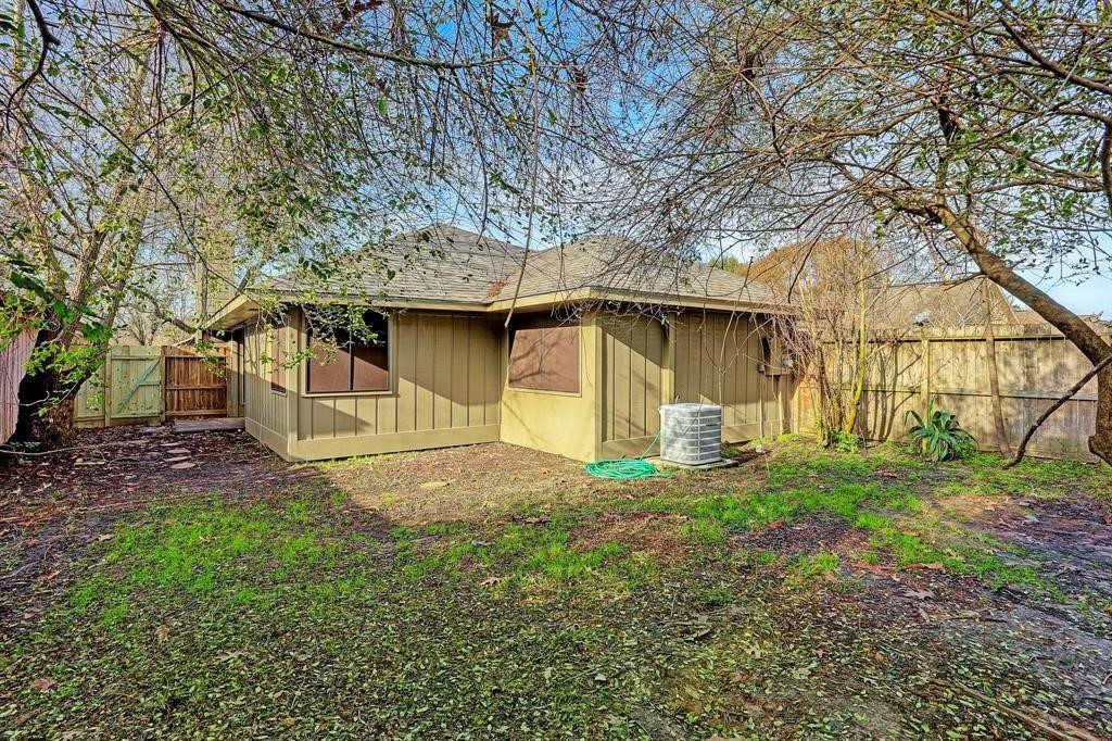 23322 Pebworth Place Spring, TX 77373 - Photo 10 of 10 a white house that has tree in front of it