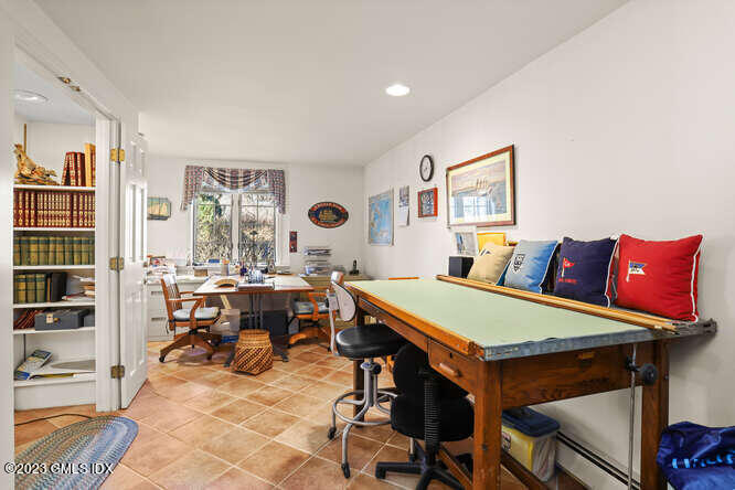 320 Cognewaugh Road Cos Cob, CT 06807 - Photo 20 of 38 a view of a dining room with furniture and chandelier
