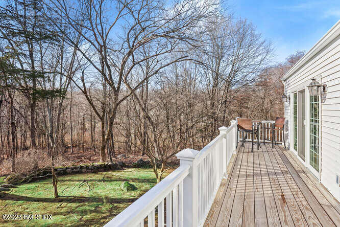 320 Cognewaugh Road Cos Cob, CT 06807 - Photo 25 of 38 a view of balcony with wooden floor and fence