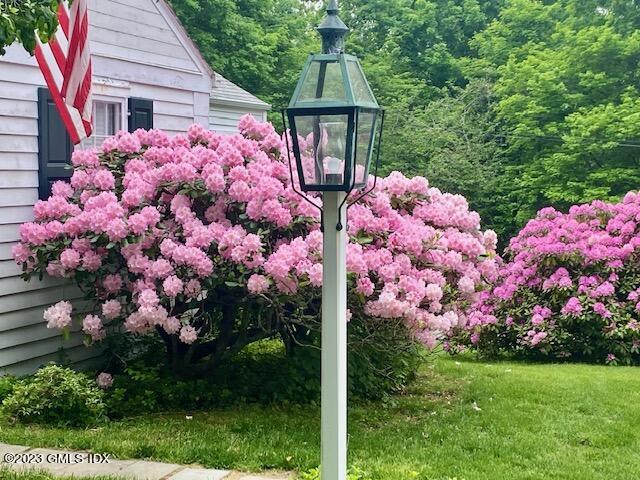 320 Cognewaugh Road Cos Cob, CT 06807 - Photo 27 of 38 a front view of a house with yard