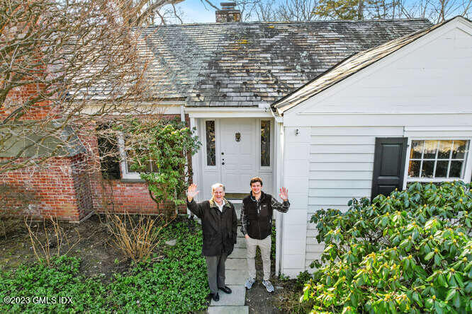 320 Cognewaugh Road Cos Cob, CT 06807 - Photo 36 of 38 a front view of a house with a yard