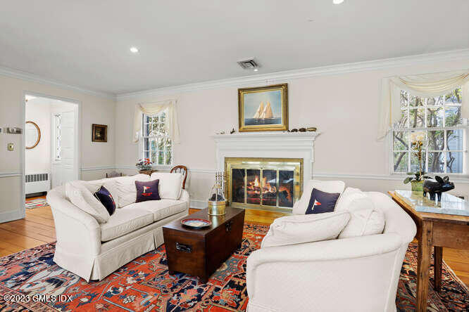 320 Cognewaugh Road Cos Cob, CT 06807 - Photo 5 of 38 a living room with furniture and a fireplace