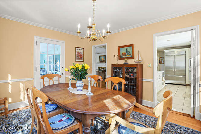 320 Cognewaugh Road Cos Cob, CT 06807 - Photo 10 of 38 a dining room with furniture a livingroom and chandelier