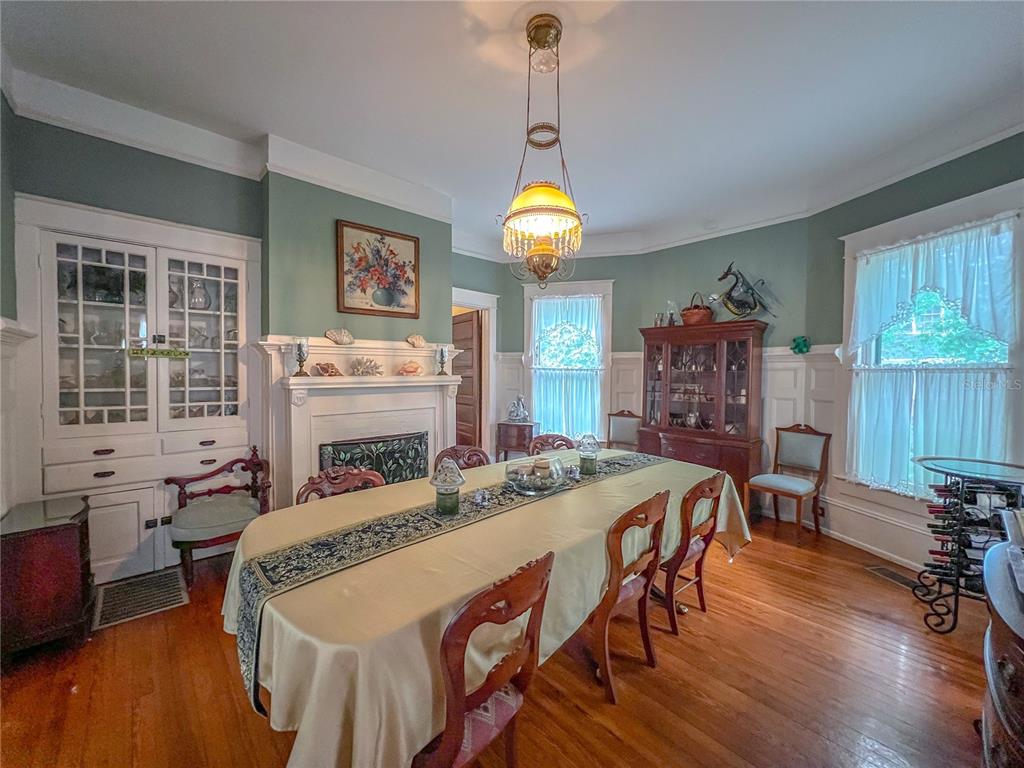 516 Northeast 4 Street Gainesville, FL 32601 - Photo 18 of 57 a dining room with furniture window and wooden floor