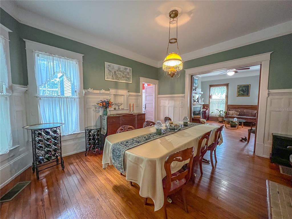 516 Northeast 4 Street Gainesville, FL 32601 - Photo 20 of 57 a view of a dining room with furniture window and wooden floor