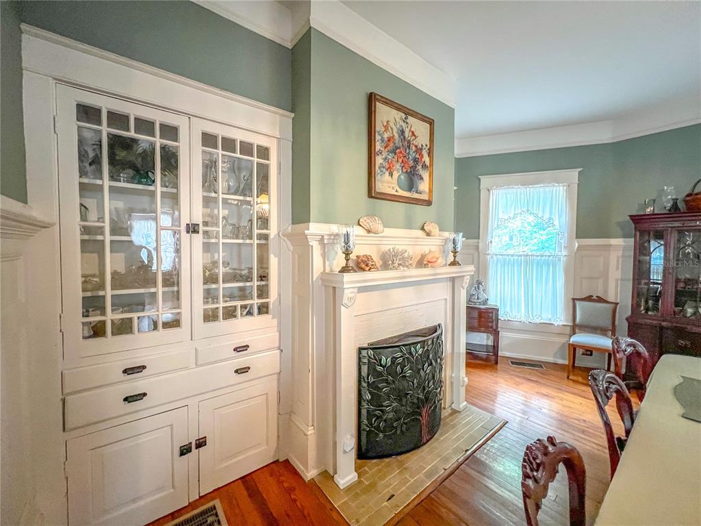 516 Northeast 4 Street Gainesville, FL 32601 - Photo 21 of 57 a living room with furniture a fireplace and a window