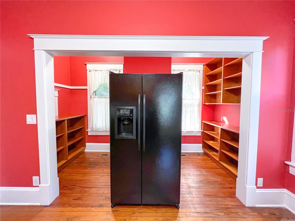 516 Northeast 4 Street Gainesville, FL 32601 - Photo 26 of 57 a view of walk in closet with wooden floor