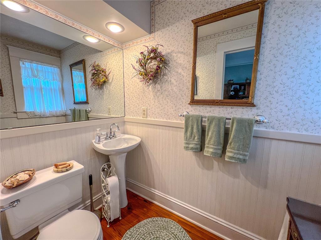 516 Northeast 4 Street Gainesville, FL 32601 - Photo 27 of 57 a bathroom with a sink a toilet and mirror