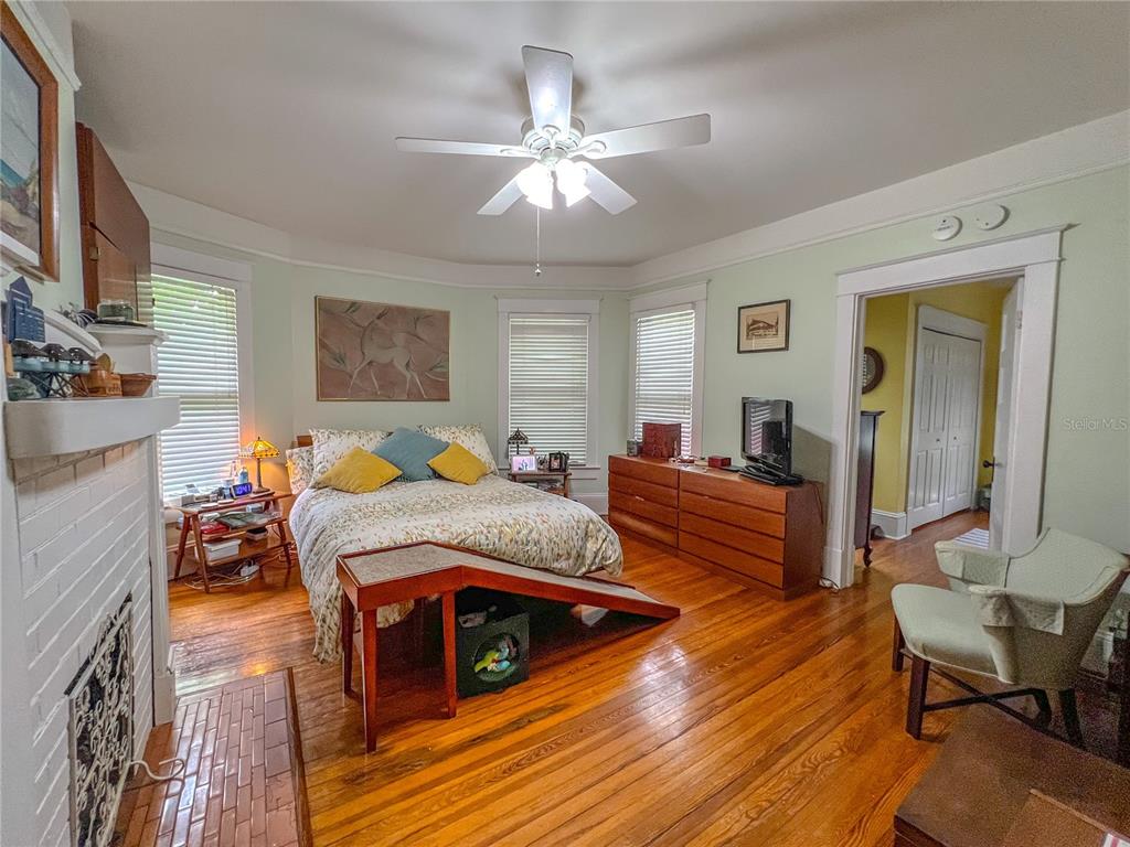 516 Northeast 4 Street Gainesville, FL 32601 - Photo 30 of 57 a bedroom with furniture and wooden floor