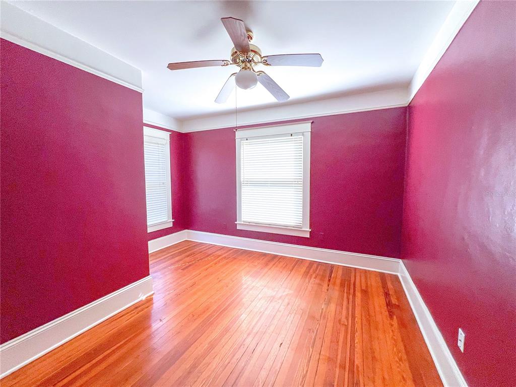 516 Northeast 4 Street Gainesville, FL 32601 - Photo 36 of 57 a view of empty room with wooden floor and fan