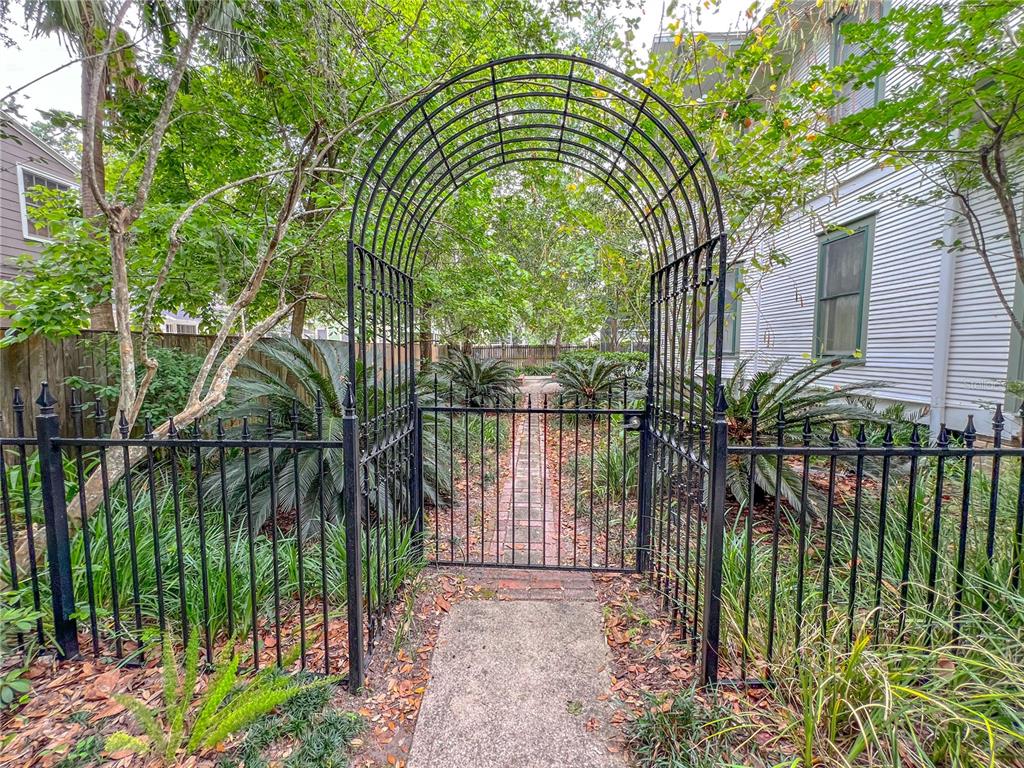 516 Northeast 4 Street Gainesville, FL 32601 - Photo 51 of 57 a backyard of a house with lots of green space