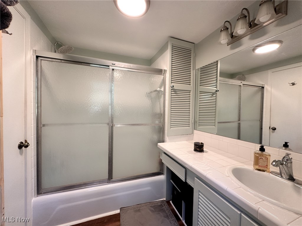8145 Chagrin Road Chagrin Falls, OH 44023 - Photo 21 of 40 Full bath with vanity and shower / bath combination with glass door