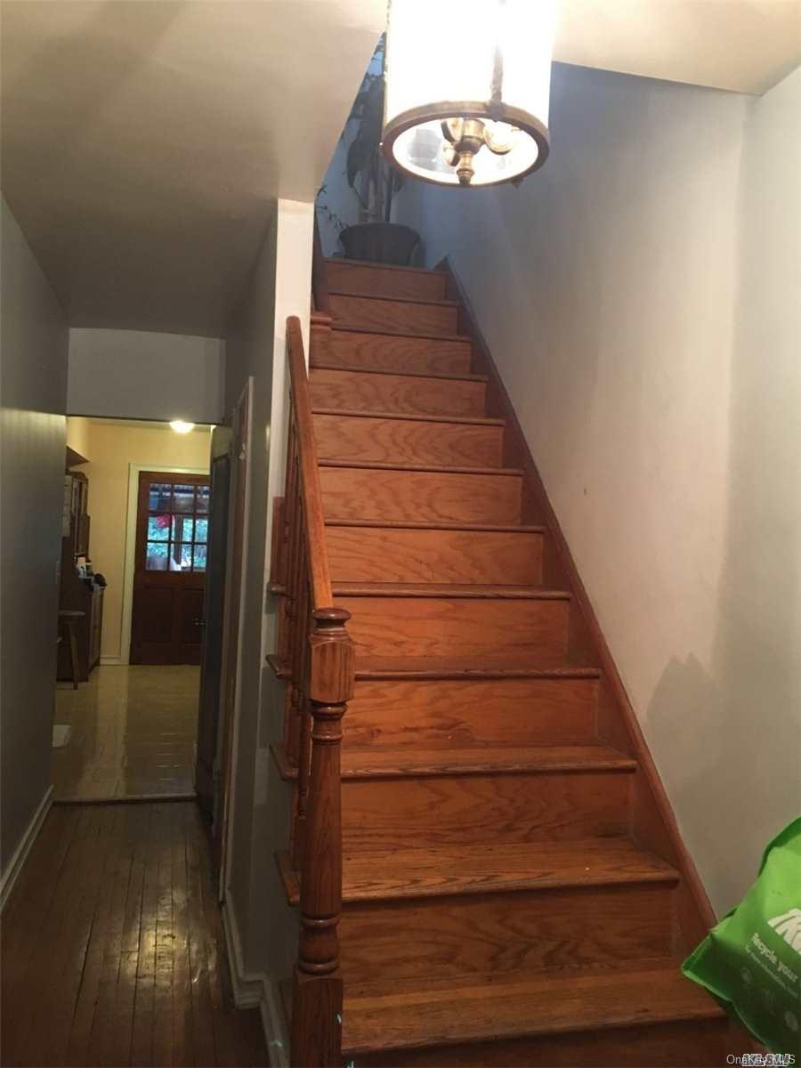 58-17 Van Cleef Street Queens, NY 11368 - Photo 4 of 6 a view of entryway and hall with wooden floor