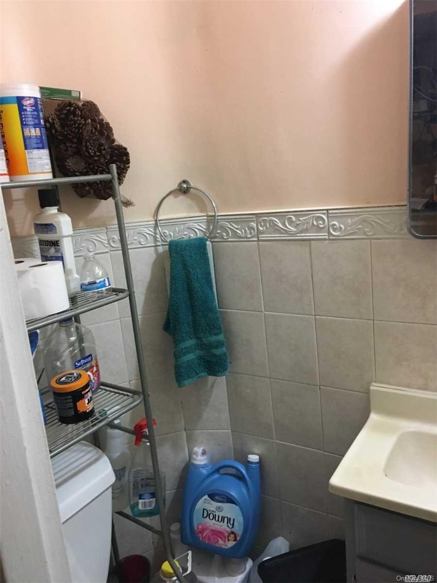 58-17 Van Cleef Street Queens, NY 11368 - Photo 5 of 6 a bathroom with a sink and a toilet