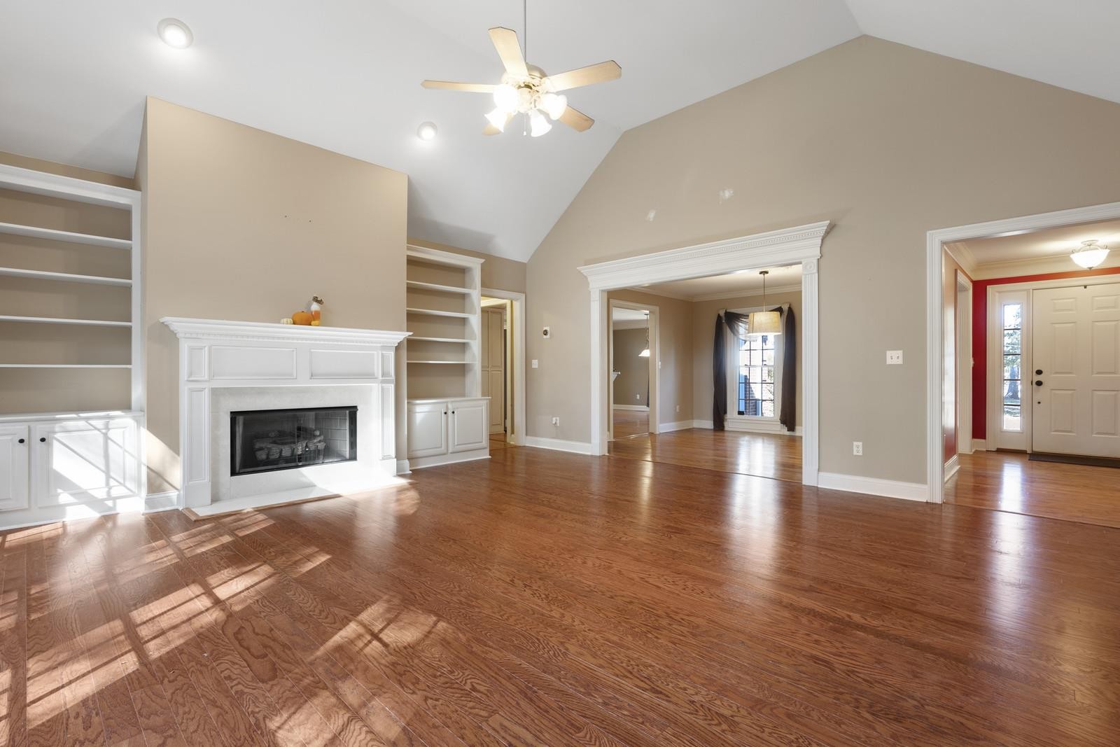 7205 Highland Road Portland, TN 37148 - Photo 7 of 29 a view of a livingroom with wooden floor and a fireplace