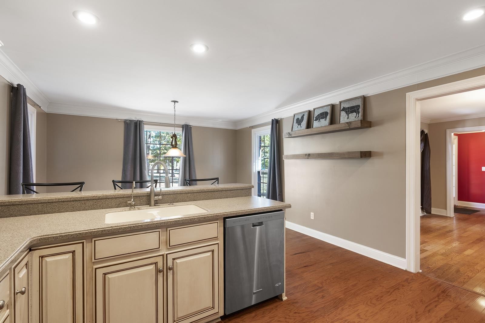 7205 Highland Road Portland, TN 37148 - Photo 9 of 29 a kitchen with a sink cabinets and wooden floor
