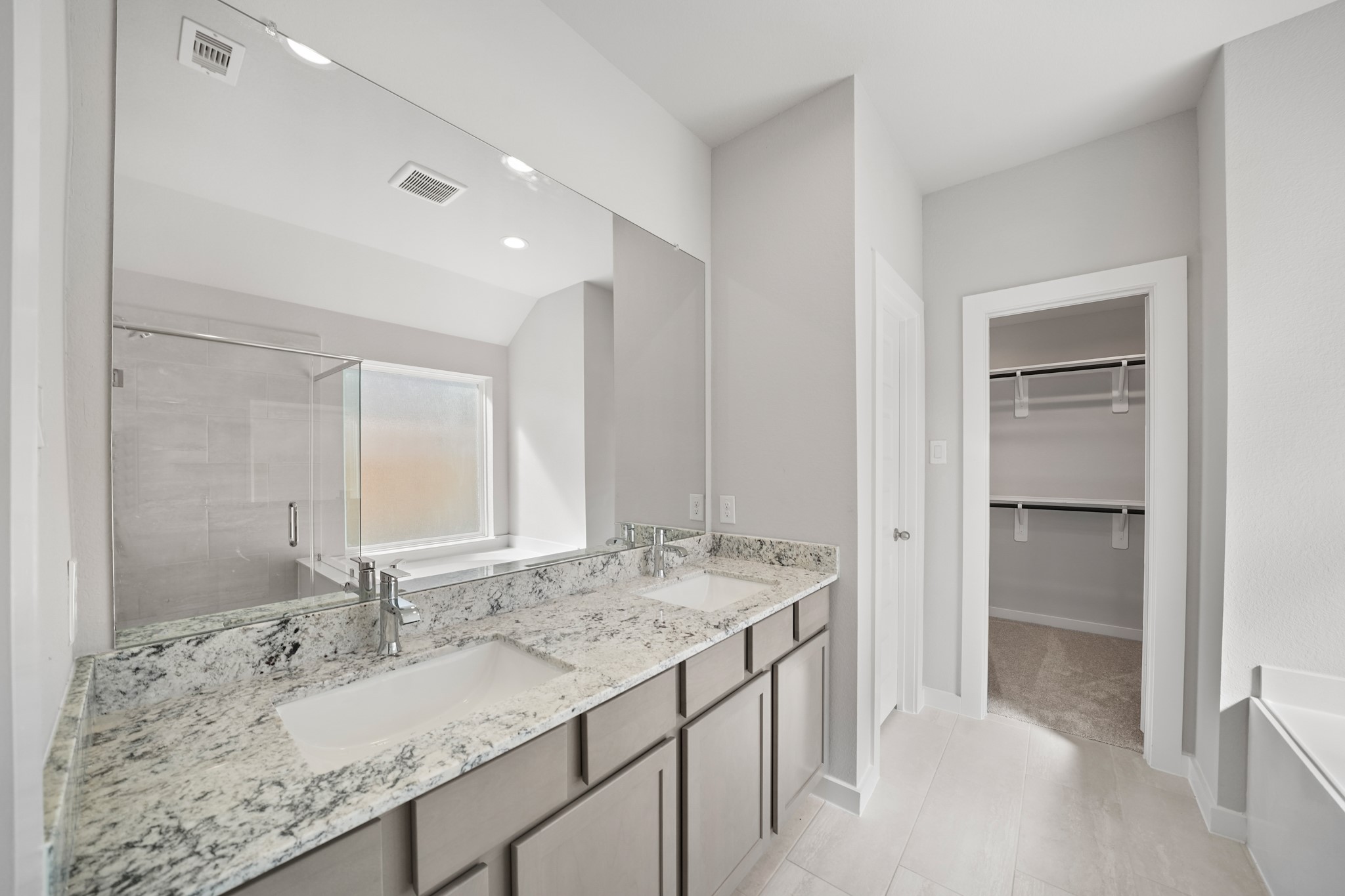 44 Shining Pt Drive Waller, TX 77484 - Photo 13 of 36 a bathroom with a granite countertop sink and a mirror