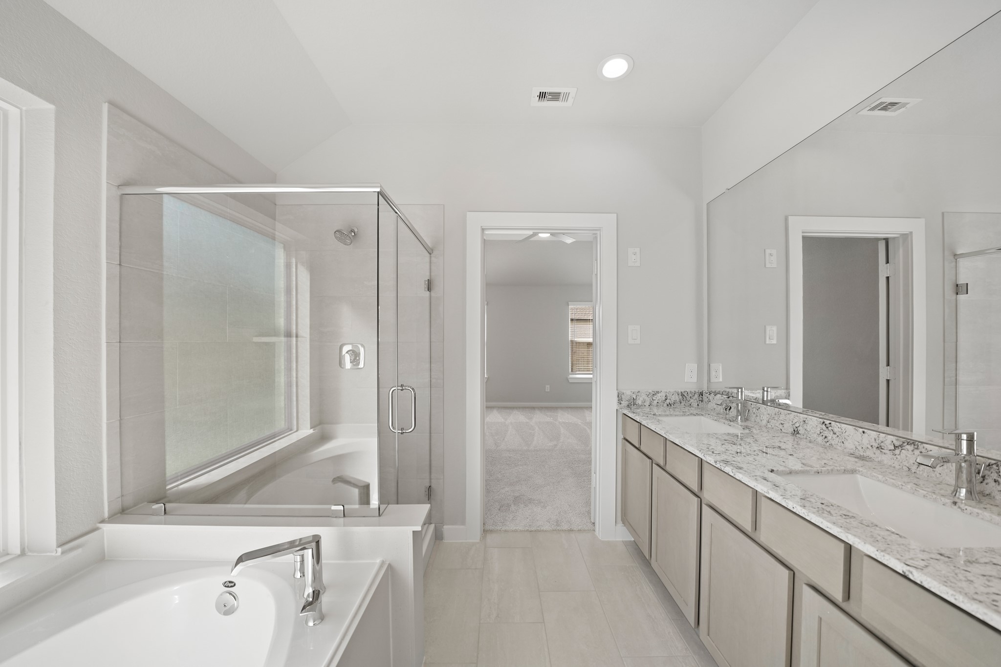 44 Shining Pt Drive Waller, TX 77484 - Photo 14 of 36 a bathroom with a granite countertop tub sink double vanity granite tub shower and mirror