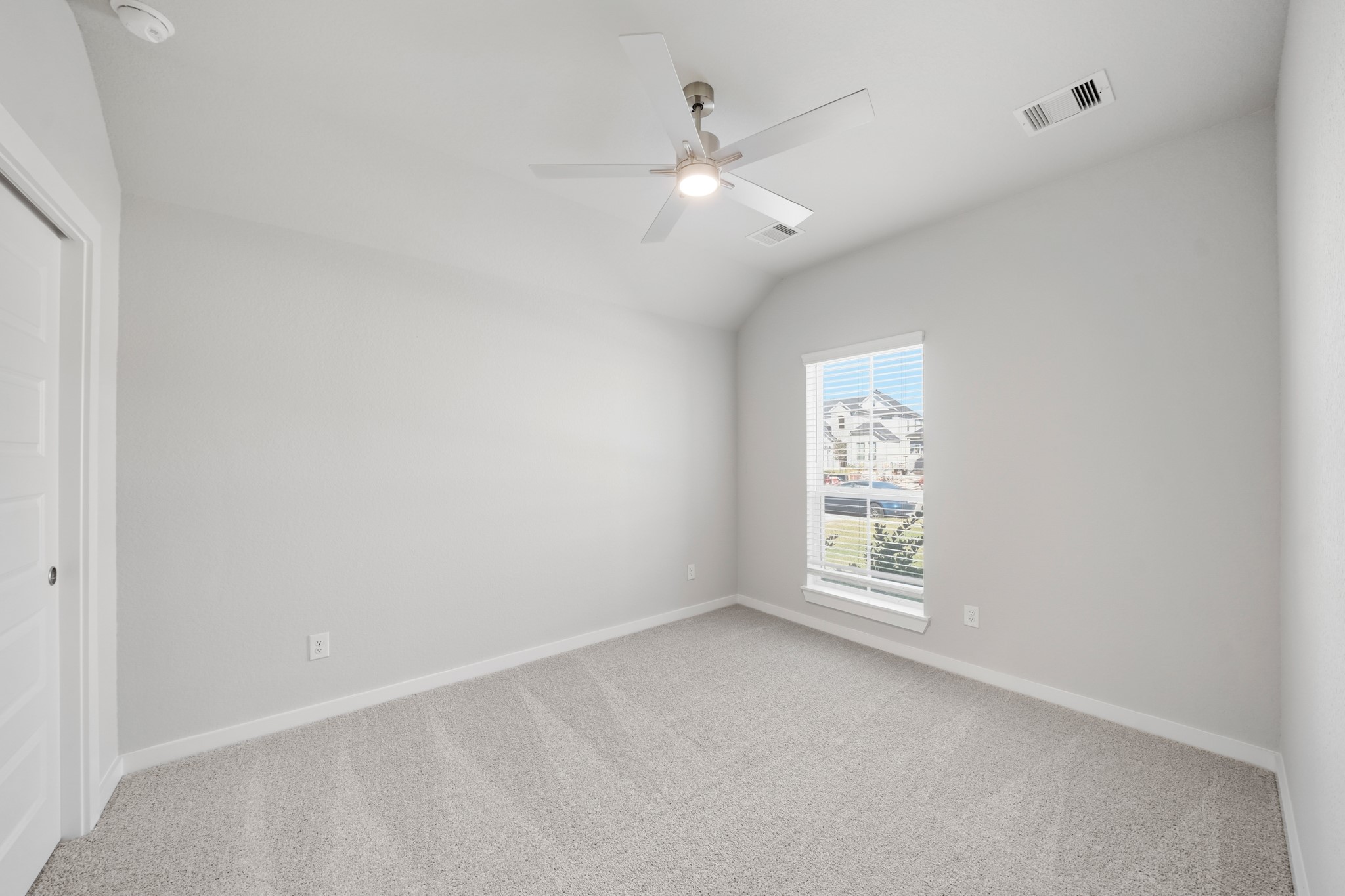 44 Shining Pt Drive Waller, TX 77484 - Photo 15 of 36 an empty room with windows and fan