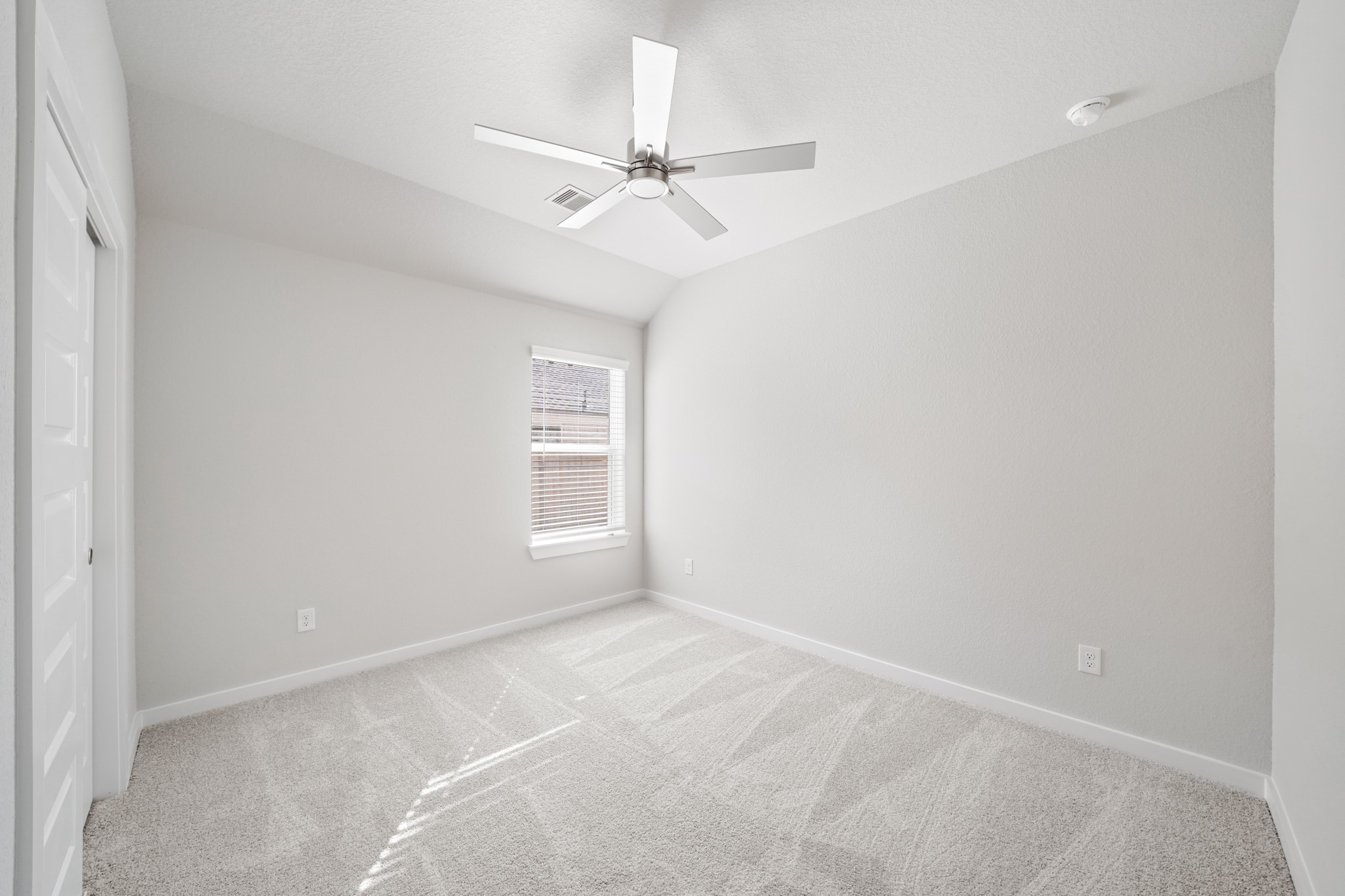44 Shining Pt Drive Waller, TX 77484 - Photo 16 of 36 an empty room with a window and a fan