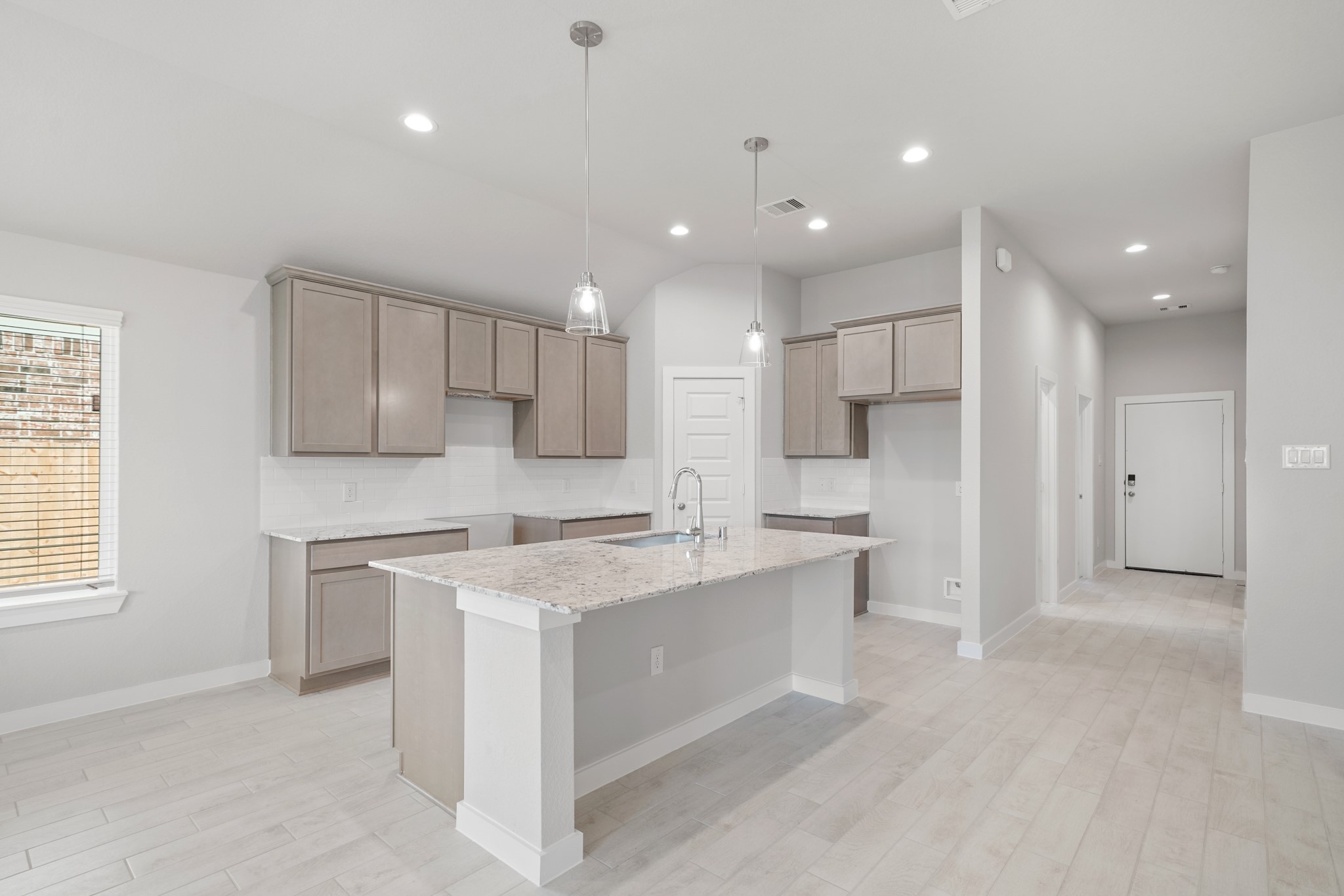 44 Shining Pt Drive Waller, TX 77484 - Photo 2 of 36 a kitchen with a sink stove and refrigerator