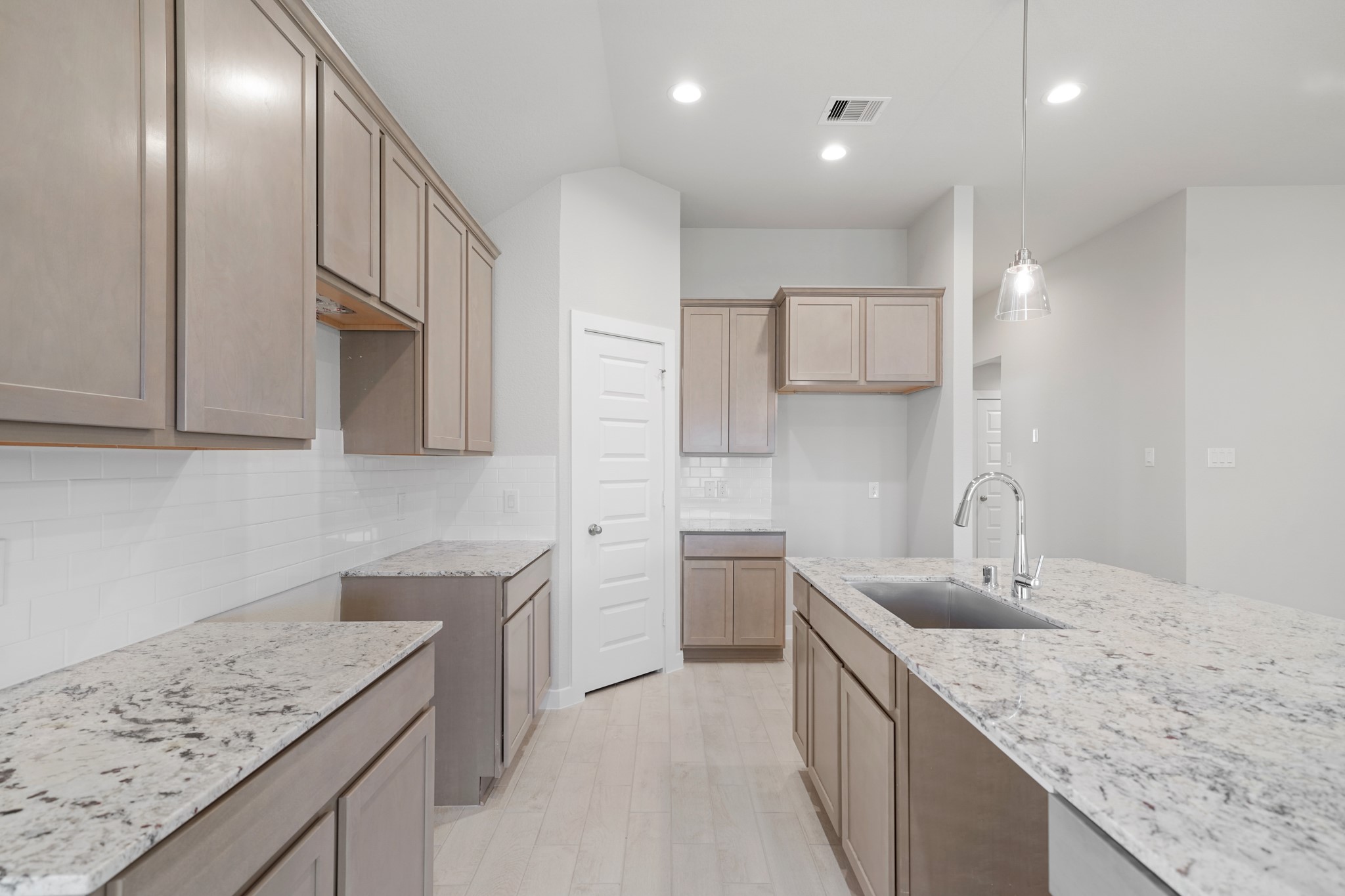44 Shining Pt Drive Waller, TX 77484 - Photo 4 of 36 a kitchen with a sink stove and cabinets