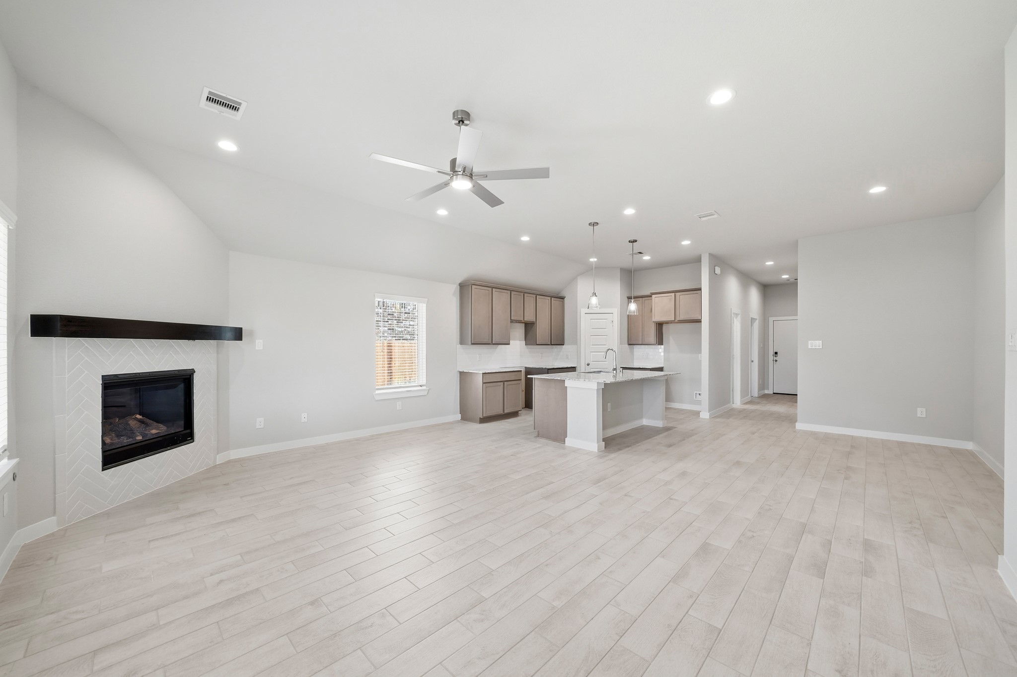 44 Shining Pt Drive Waller, TX 77484 - Photo 7 of 36 a view of kitchen with furniture and a fireplace