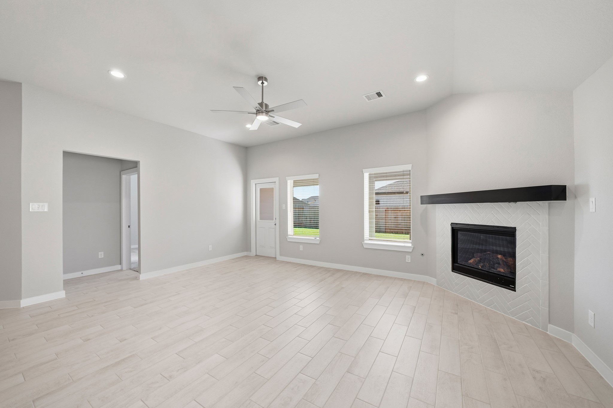 44 Shining Pt Drive Waller, TX 77484 - Photo 8 of 36 a view of an empty room with a fireplace and a window