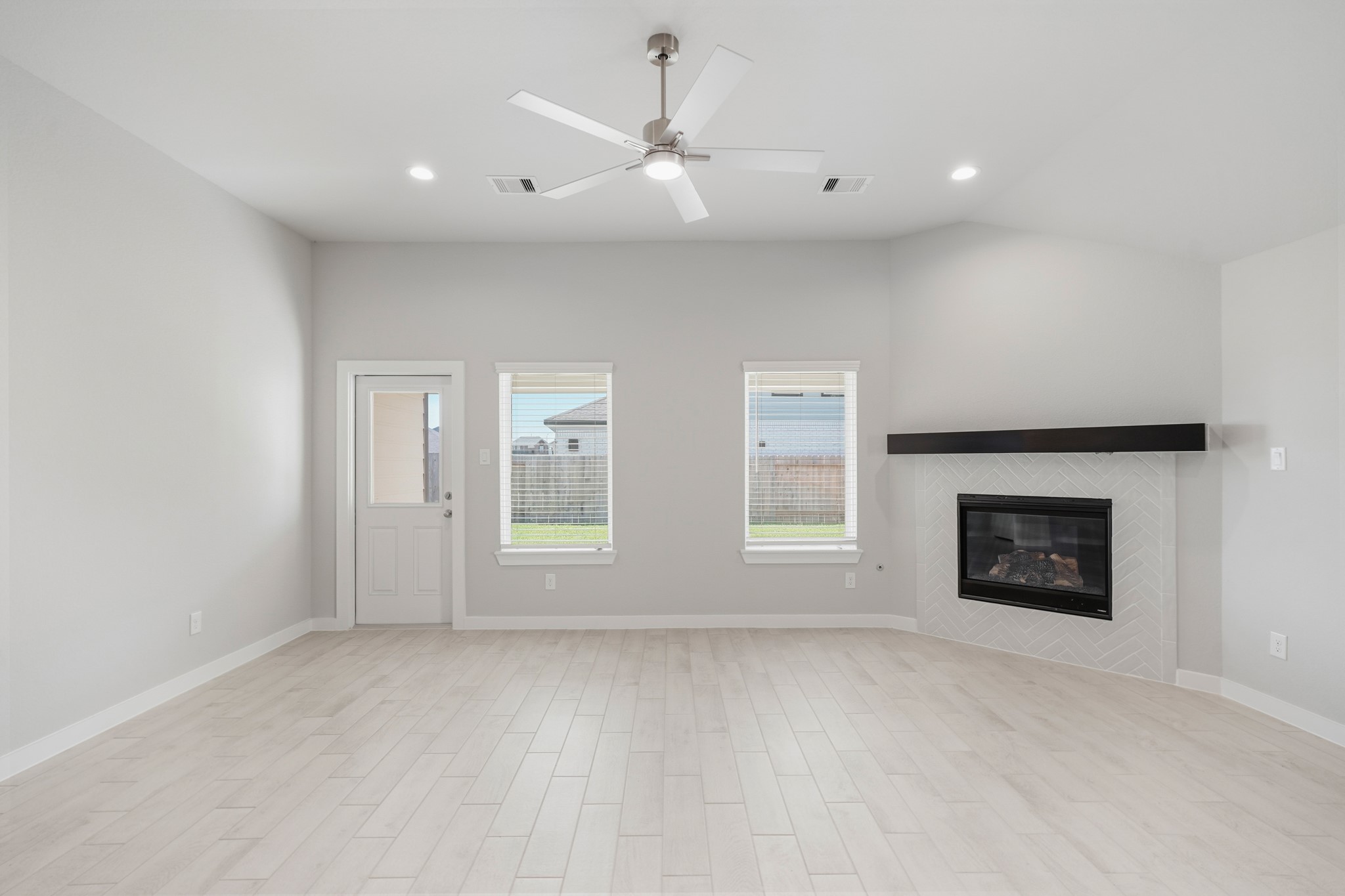 44 Shining Pt Drive Waller, TX 77484 - Photo 9 of 36 an empty room with windows and fireplace