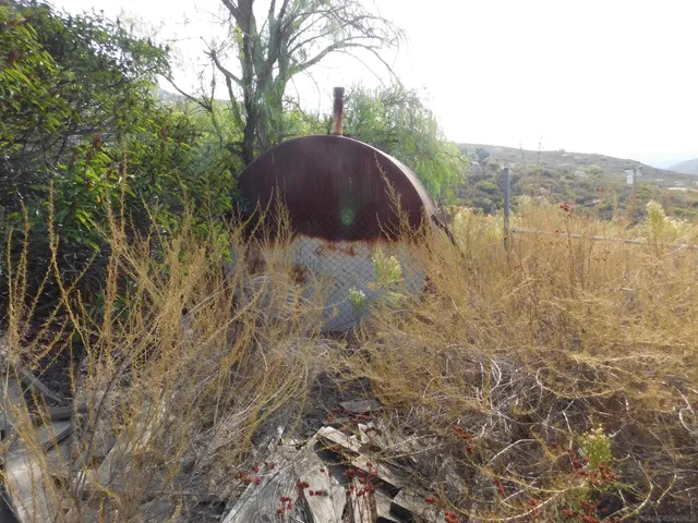 a view of lake with mountain in the background