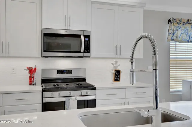 a bedroom with furniture and a flat screen tv
