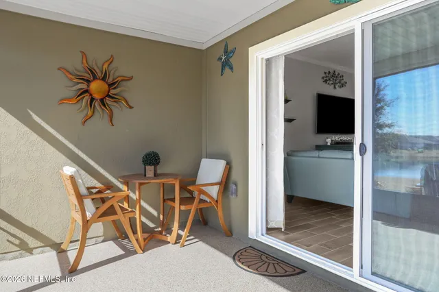 a view of a lake with houses in the back