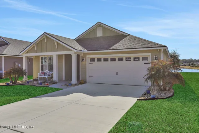 a view of a swimming pool with a yard