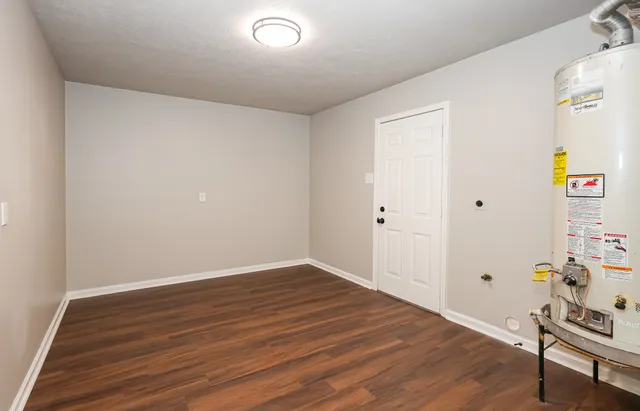 a view of room with wooden floor