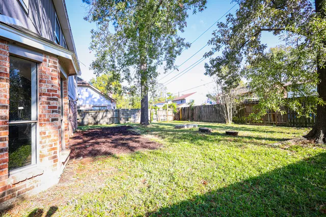 a view of a yard with swimming pool