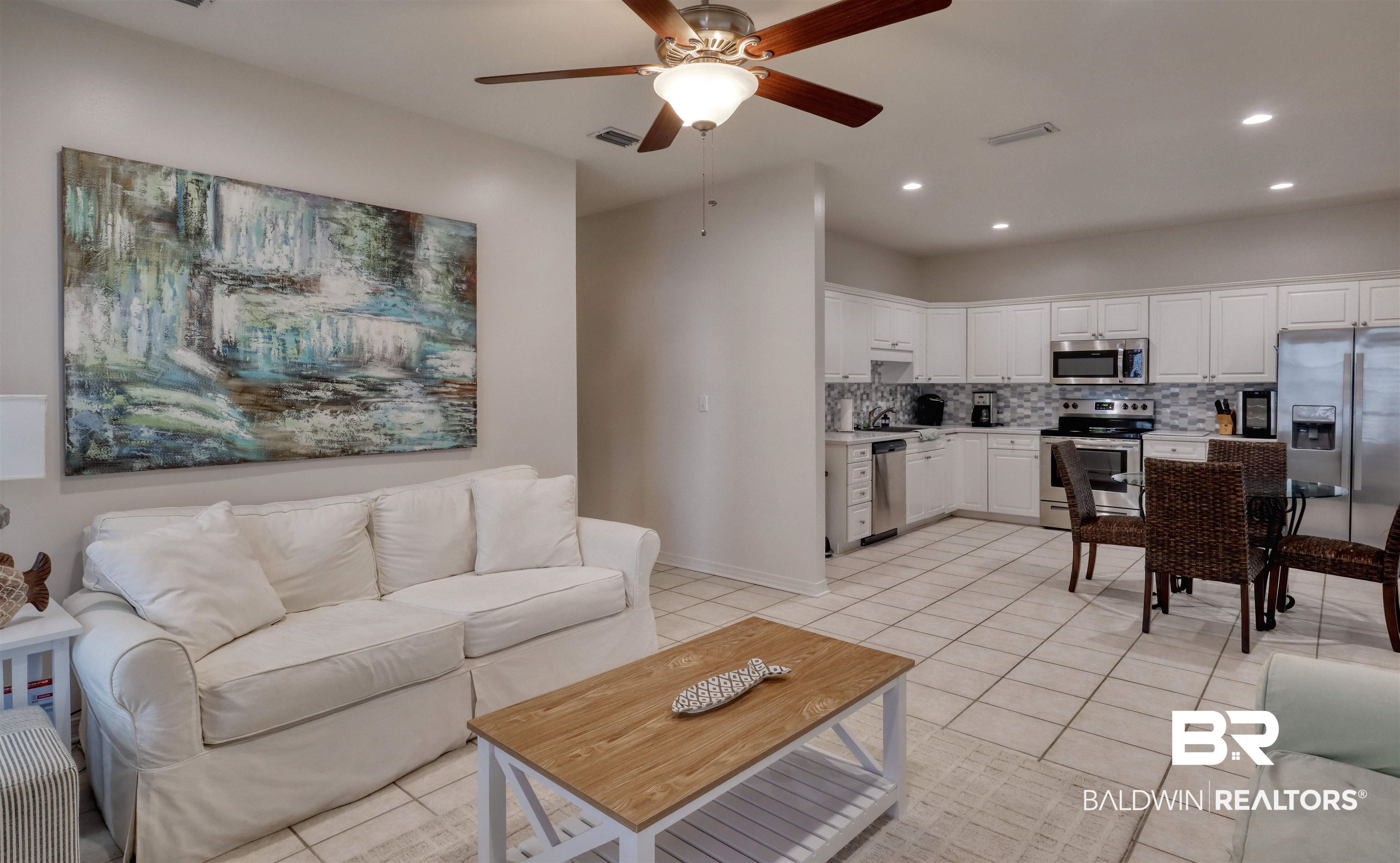 26063 Canal Road, Unit C2 Orange Beach, AL 36561 - Photo 8 of 30 Living room featuring recessed lighting, a ceiling fan, and light tile patterned floors