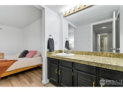 a en suite bathroom with a sink and mirror