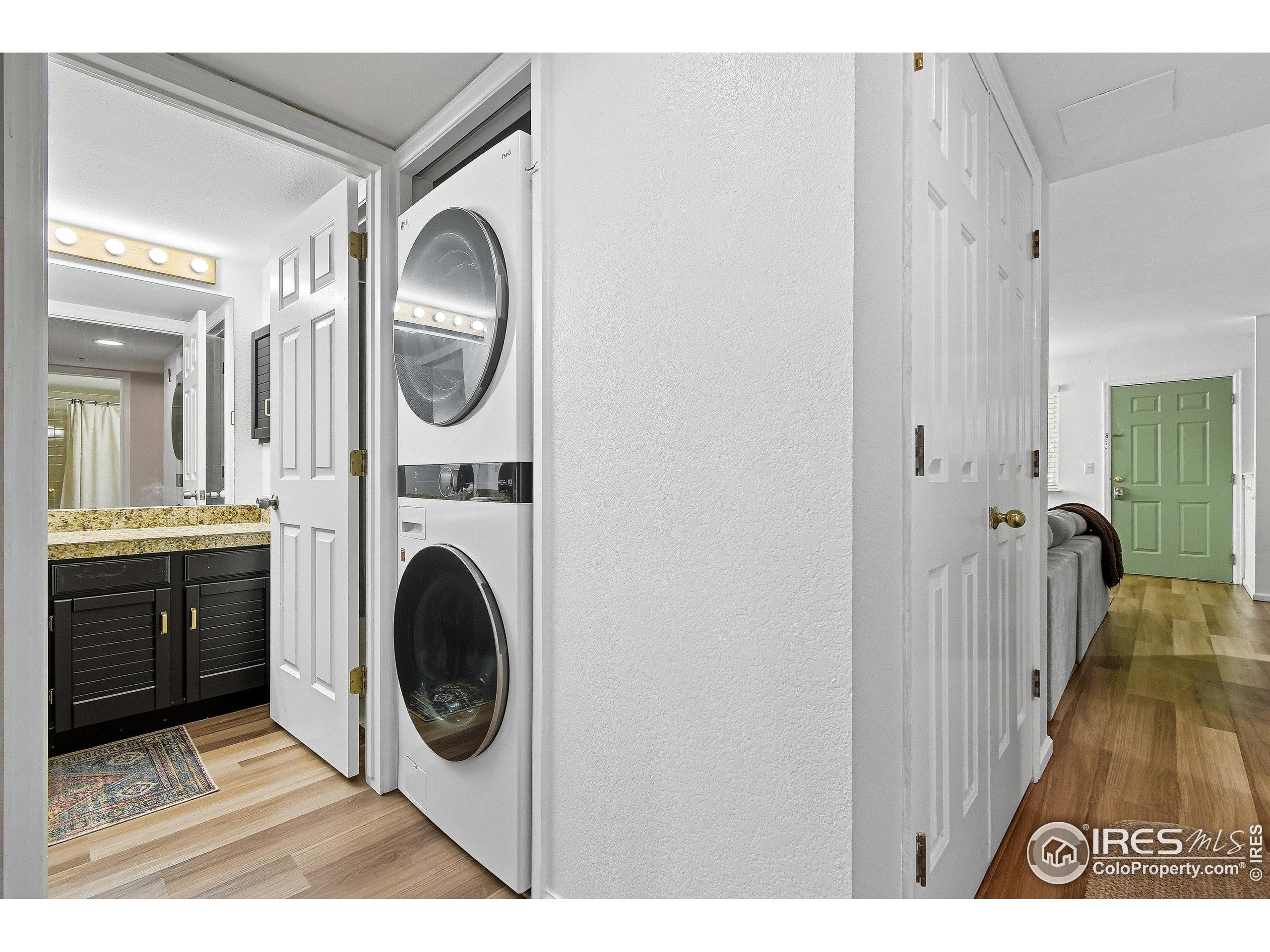 935 Broadway, Unit 104 Boulder, CO 80302 - Photo 13 of 21 a view of a kitchen with a washer and dryer