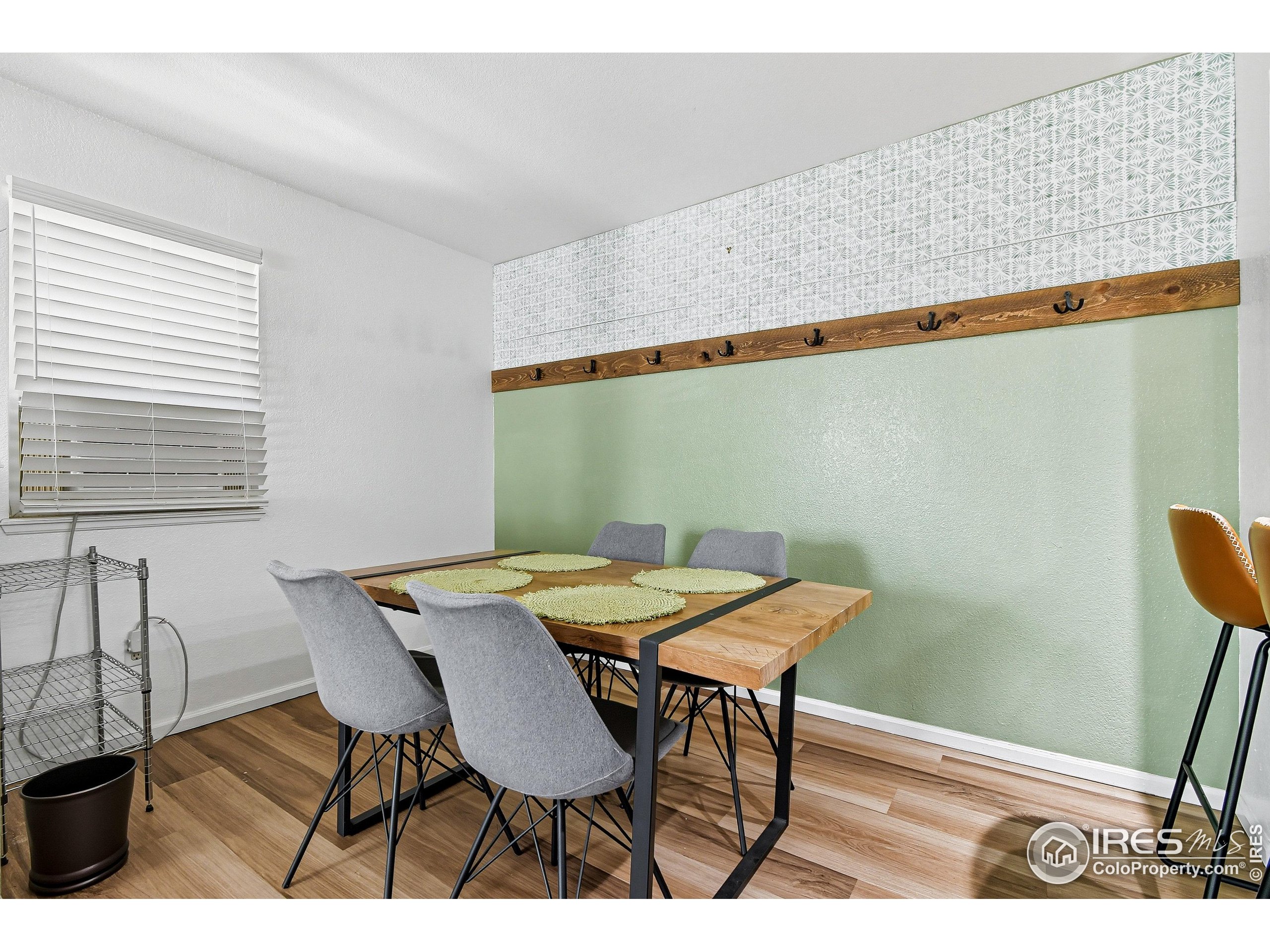 935 Broadway, Unit 104 Boulder, CO 80302 - Photo 5 of 21 a view of a dining room with furniture and window