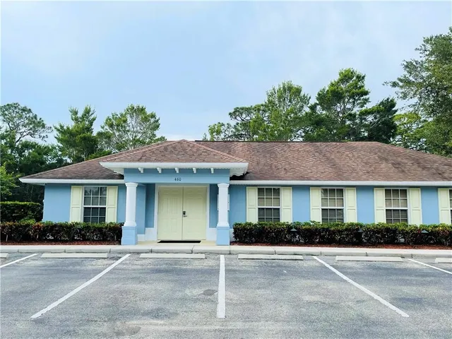 a view of a dining room with furniture wooden floor and chandelier