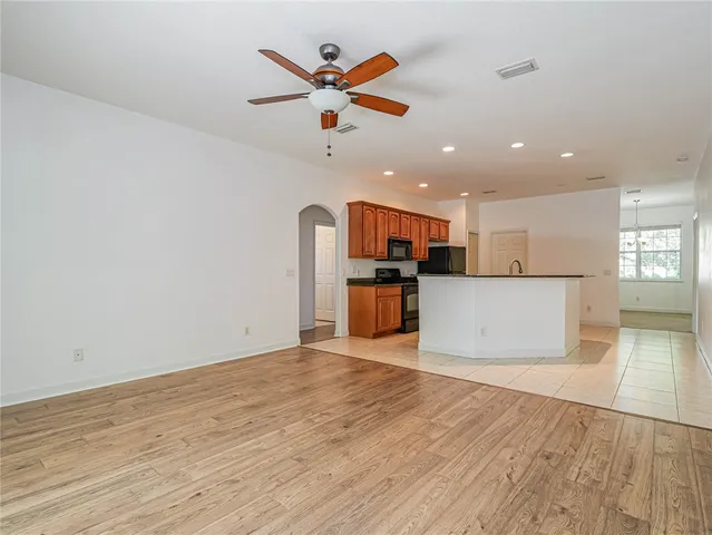 a view of a kitchen with microwave and cabinets