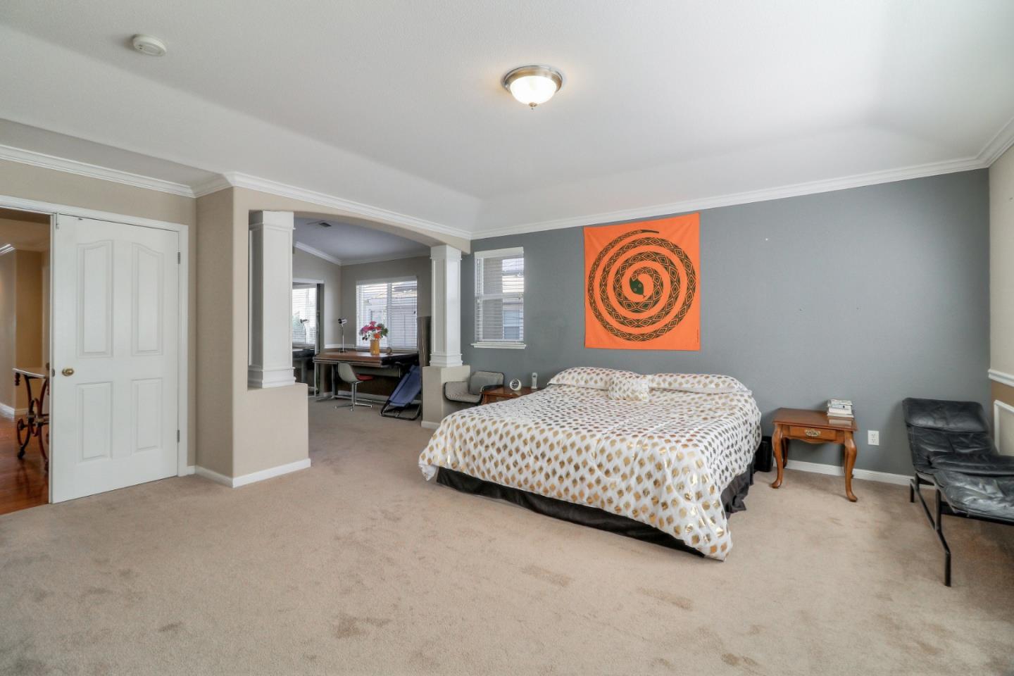 9402 Rodeo Drive Gilroy, CA 95020 - Photo 21 of 39 a bedroom with a bed and a chandelier