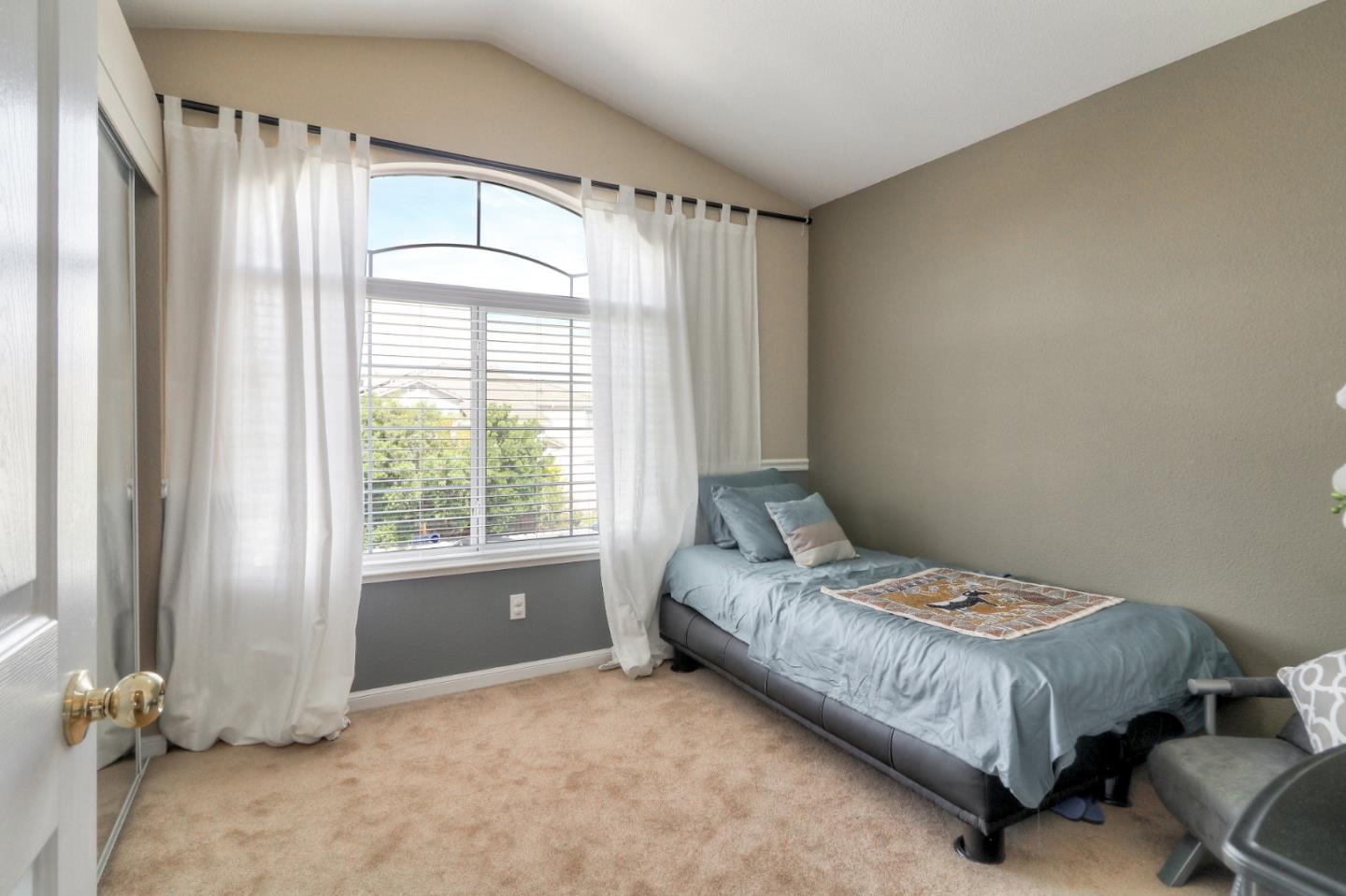 9402 Rodeo Drive Gilroy, CA 95020 - Photo 25 of 39 a room with a bed and a window