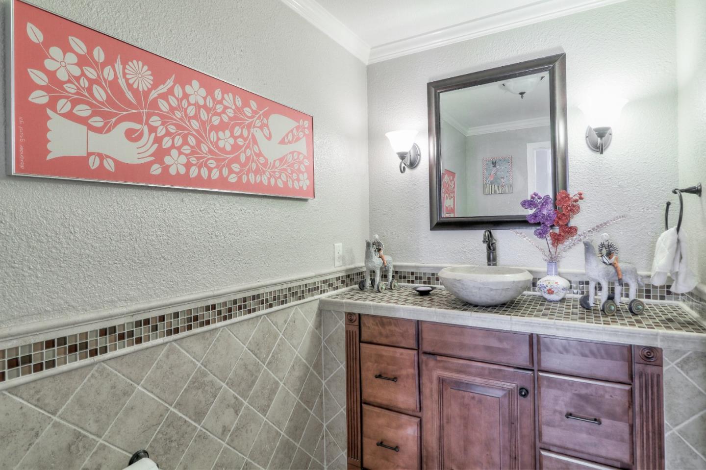 9402 Rodeo Drive Gilroy, CA 95020 - Photo 32 of 39 a bathroom with a granite countertop sink and a mirror