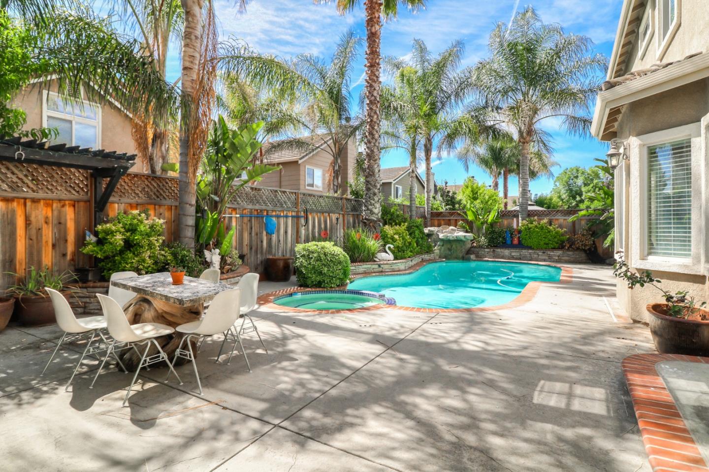 9402 Rodeo Drive Gilroy, CA 95020 - Photo 34 of 39 a view of a patio with a table and chairs and potted plants