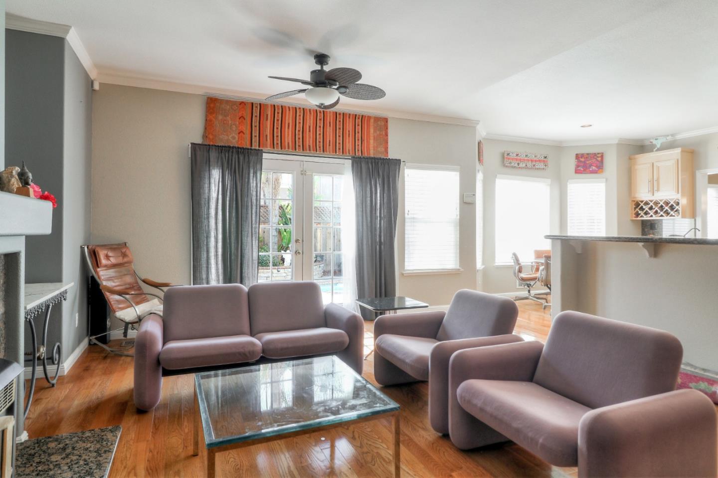 9402 Rodeo Drive Gilroy, CA 95020 - Photo 9 of 39 a living room with furniture a ceiling fan and a window