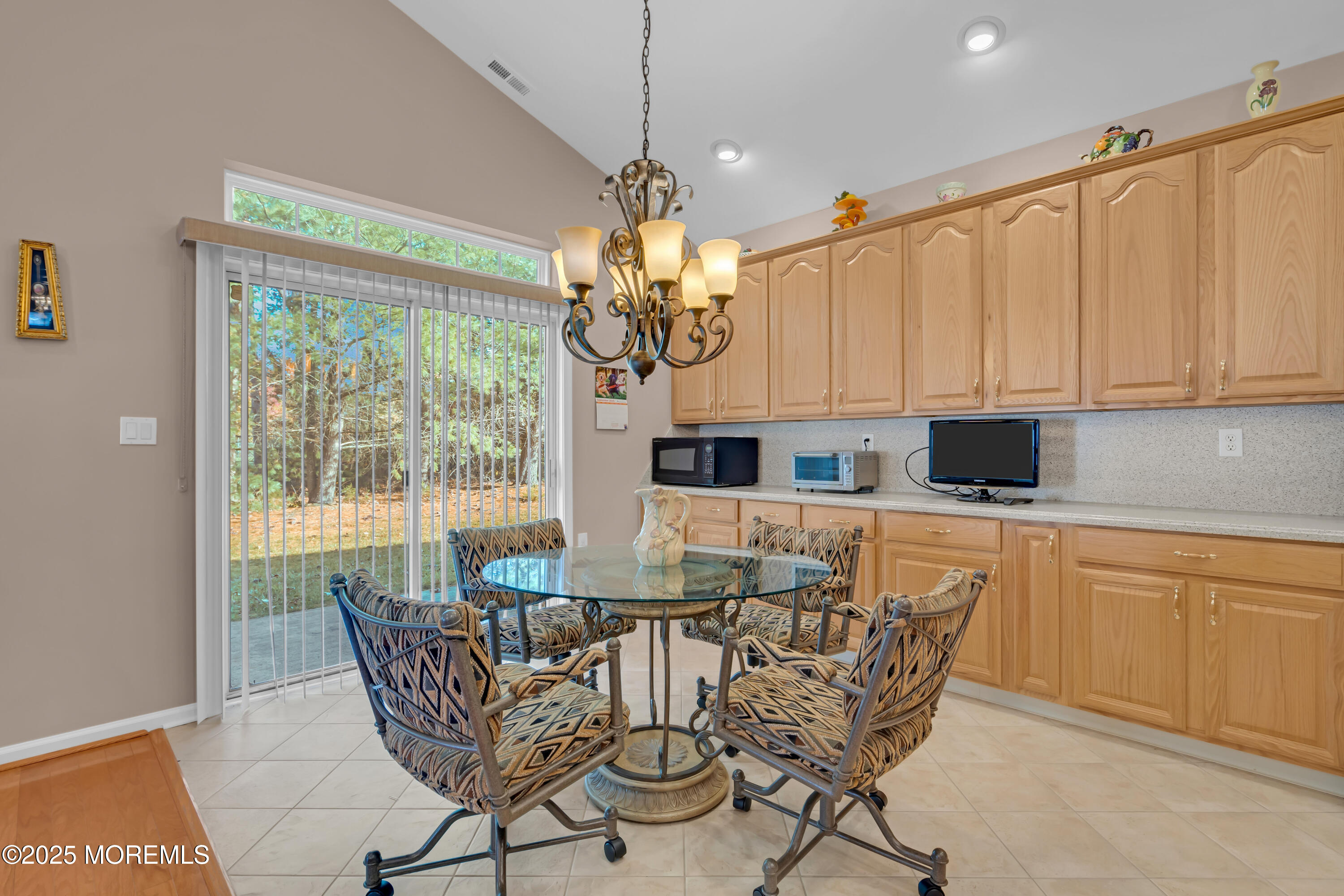 60 Eleanor Road Manchester Township, NJ 08759 - Photo 28 of 45 a dining area with furniture a chandelier and window