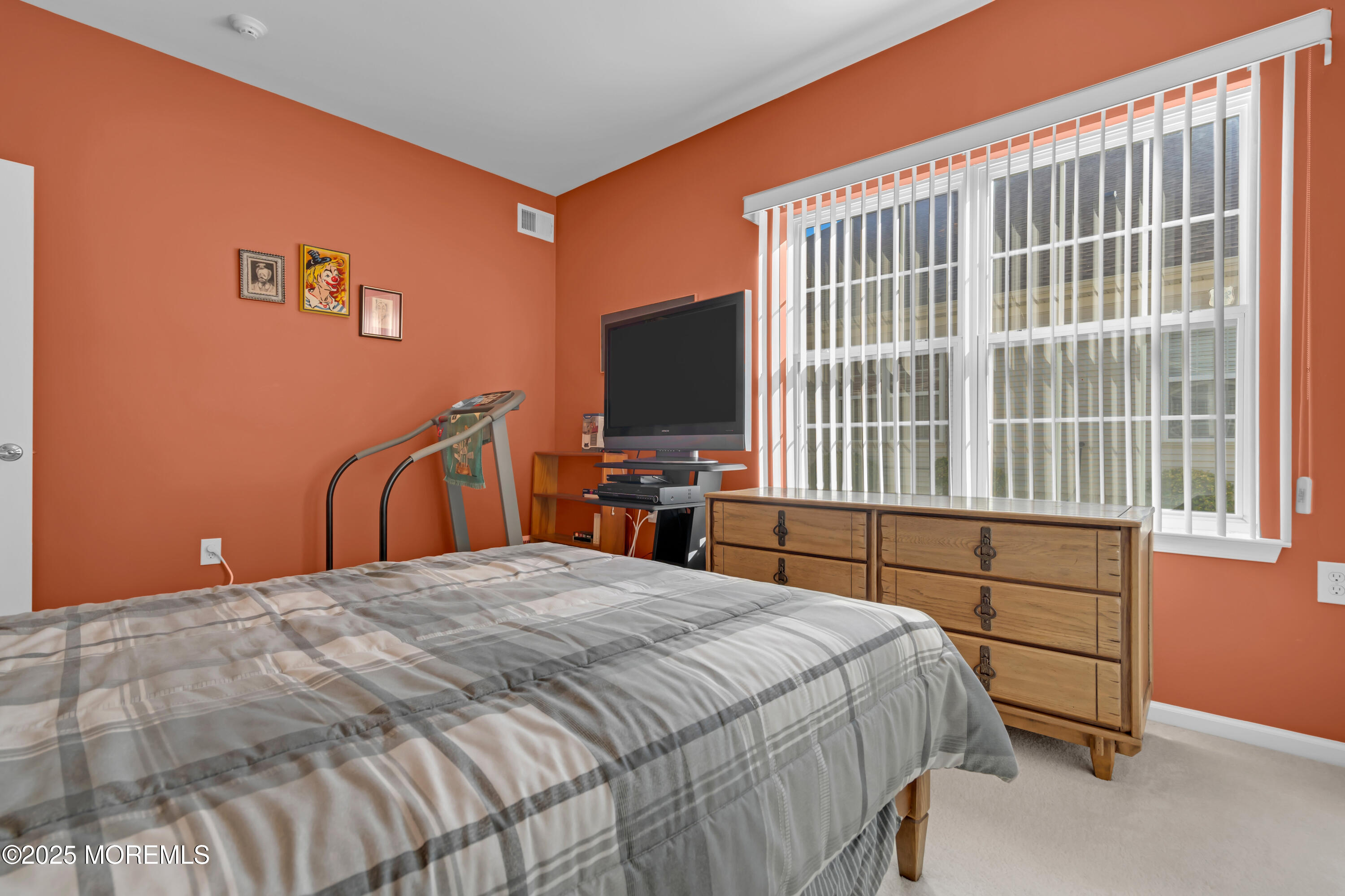 60 Eleanor Road Manchester Township, NJ 08759 - Photo 29 of 45 a bedroom with a large bed and a flat tv screen on dresser