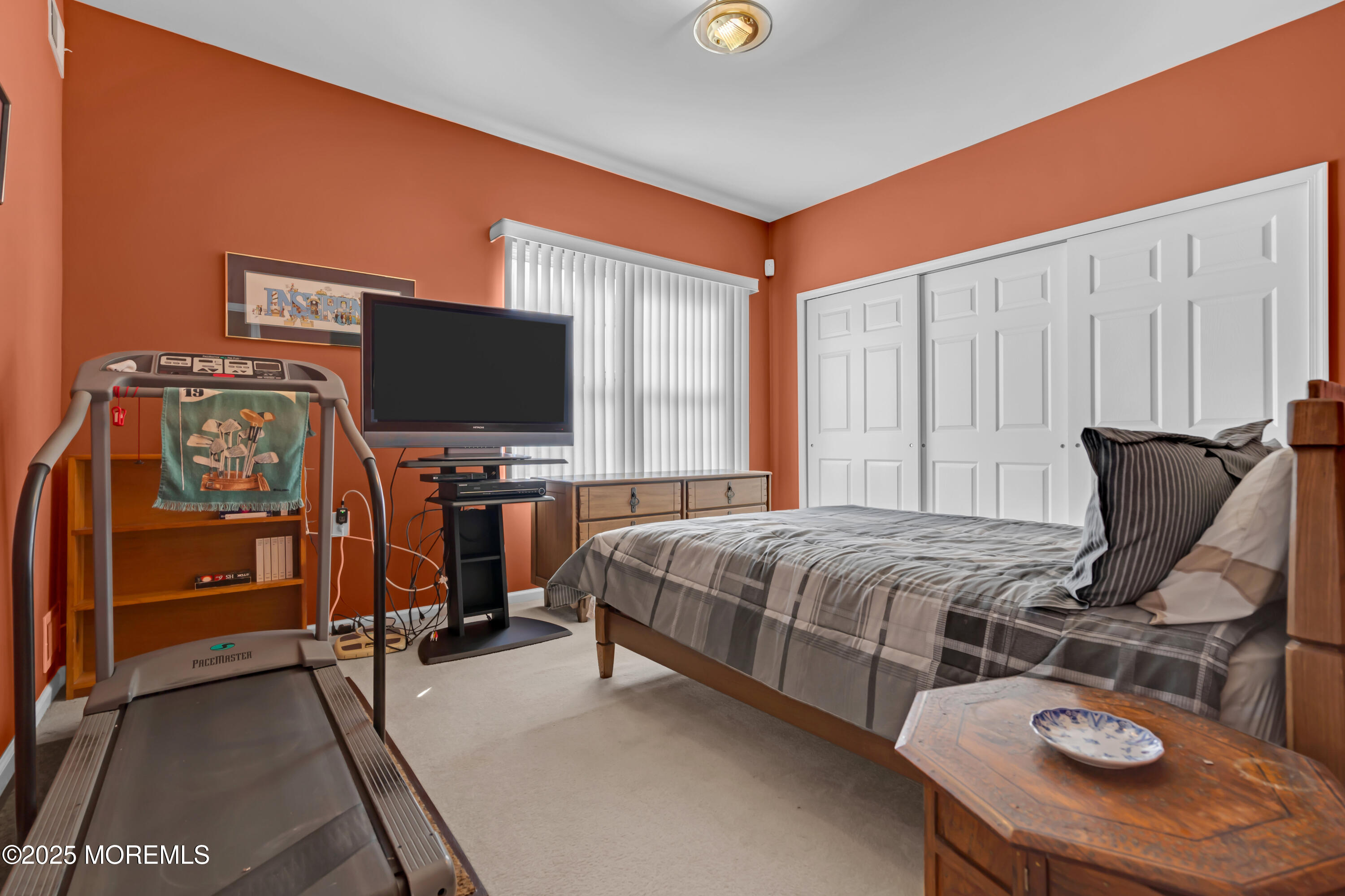 60 Eleanor Road Manchester Township, NJ 08759 - Photo 34 of 45 a bedroom with a bed and flat screen tv