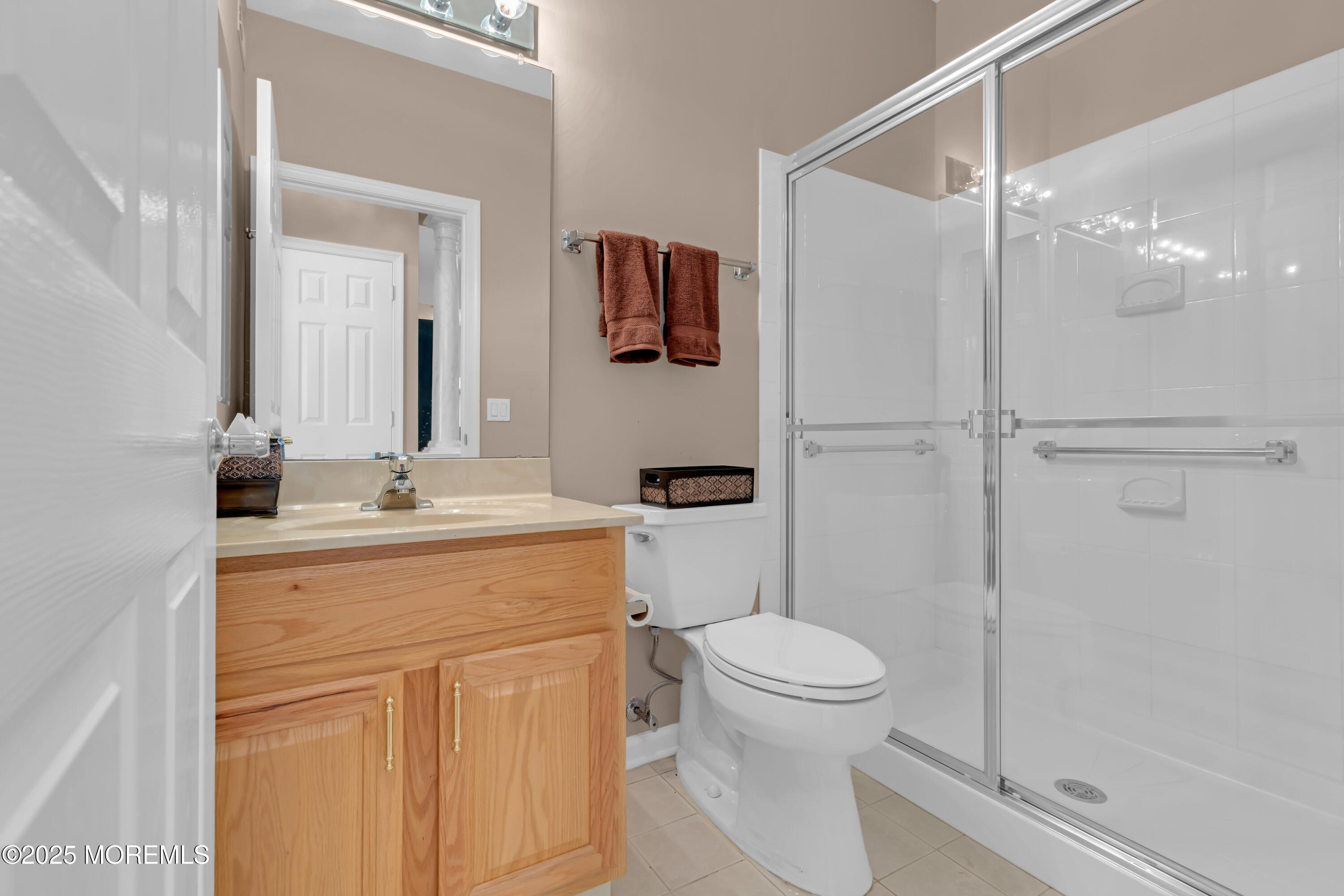 60 Eleanor Road Manchester Township, NJ 08759 - Photo 36 of 45 a bathroom with a toilet sink and shower